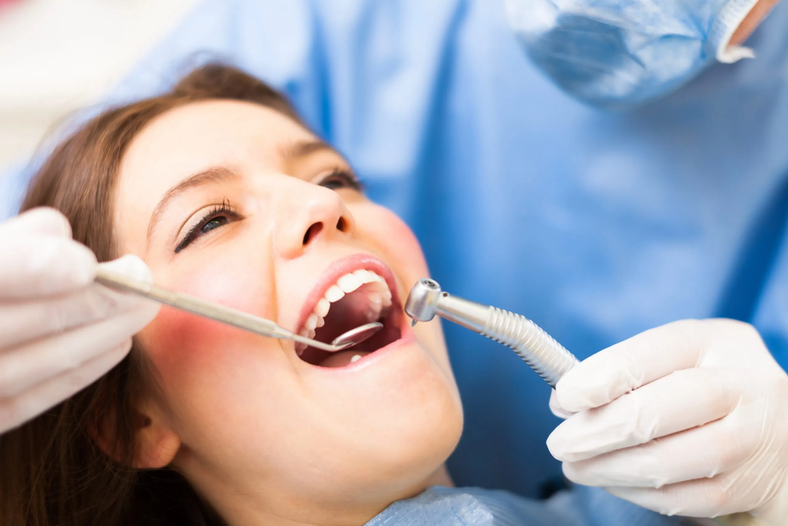 Dentist performing comprehensive dental restoration at Smilezone practice in Zug, Switzerland.