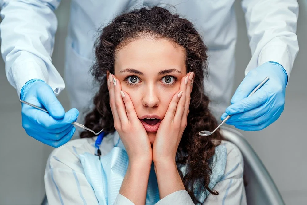 Relaxed female patient preparing for a gentle dental treatment at Smilezone.