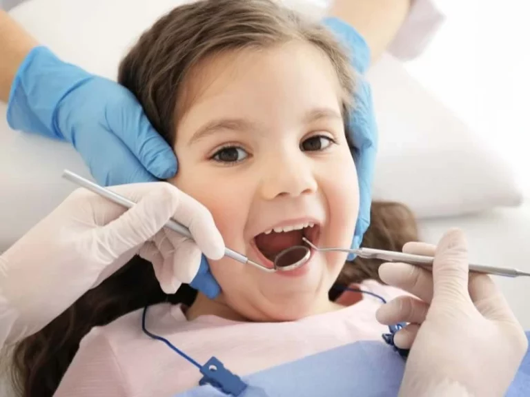 Smiling child at Smilezone Zug; caring pediatric dentist offers gentle children's dentistry.